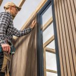 Professional Caucasian Construction Worker in His 40s Building Modern Composite and Wood Made Shed